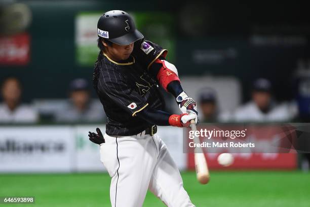 Infielder Tetsuto Yamada of Japan hits a solo homer in the top of the first inning during the SAMURAI JAPAN Send-off Friendly Match between CPBL...