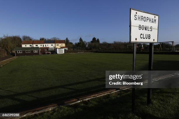 Sign reading "Shropham Bowls Club" stands on the perimeter of a bowling green in Shropham, U.K., on Friday, Feb. 3, 2017. Traditional Norfolk Poultry...