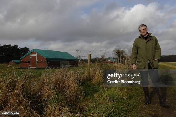 Mark Gorton, joint managing director of Traditional Norfolk Poultry Ltd. , poses for a photograph in front of mobile poultry housing at his farm in...