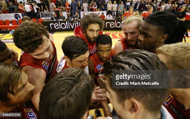 Wildcats players huddle after victory in game two of the NBL Grand Final series between the Perth Wildcats and the Illawarra Hawks at WIN...