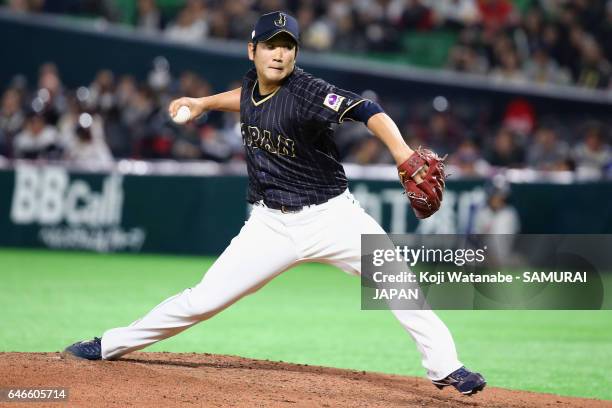 Pitcher Tomoyuki Sugano of Japan throws in the bottom of the first inning during the SAMURAI JAPAN Send-off Friendly Match between CPBL Selected Team...