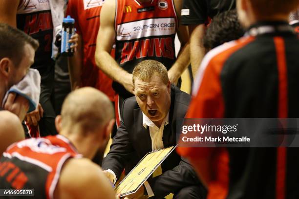 Hawks coach Rob Beveridge talks to players during game two of the NBL Grand Final series between the Perth Wildcats and the Illawarra Hawks at WIN...