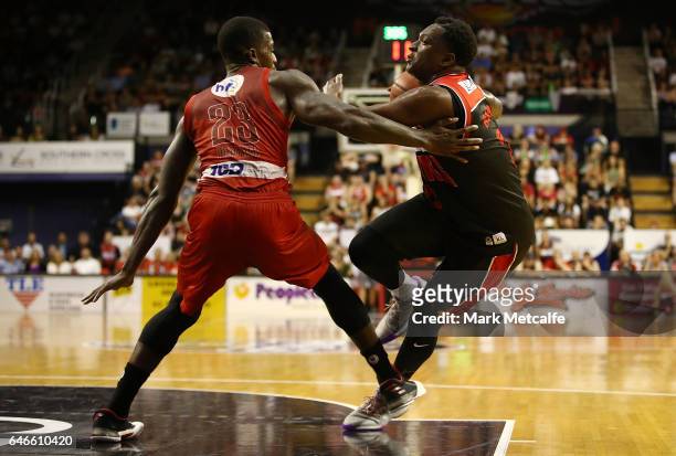 Marvelle Harris of the Hawks takes on Casey Prather of the Wildcats during game two of the NBL Grand Final series between the Perth Wildcats and the...