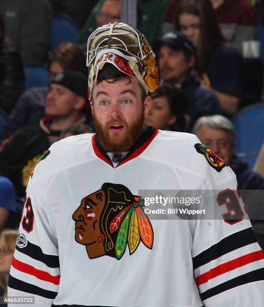 Scott Darling of the Chicago Blackhawks takes a break during an NHL game against the Buffalo Sabres at the KeyBank Center on February 19, 2017 in...