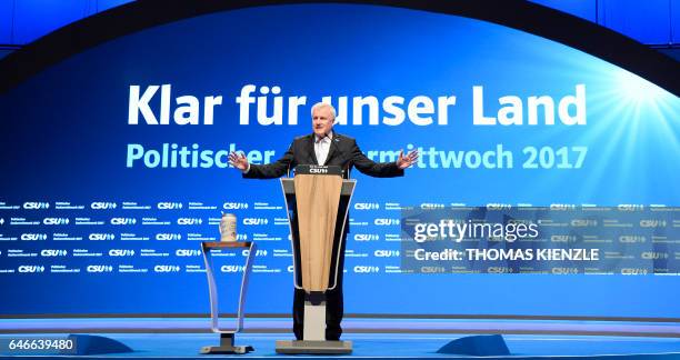 Bavarian State Premier and head of German Christian Social Union party Horst Seehofer reacts on the stage during the party's traditional Ash...