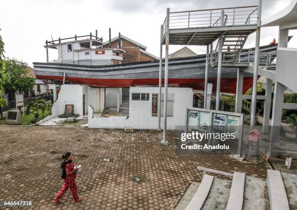 Fishing boat, which washed ashore from the Indian Ocean tsunami of 2004 and landed on top of a house in Lampulo village is seen in Banda Aceh,...