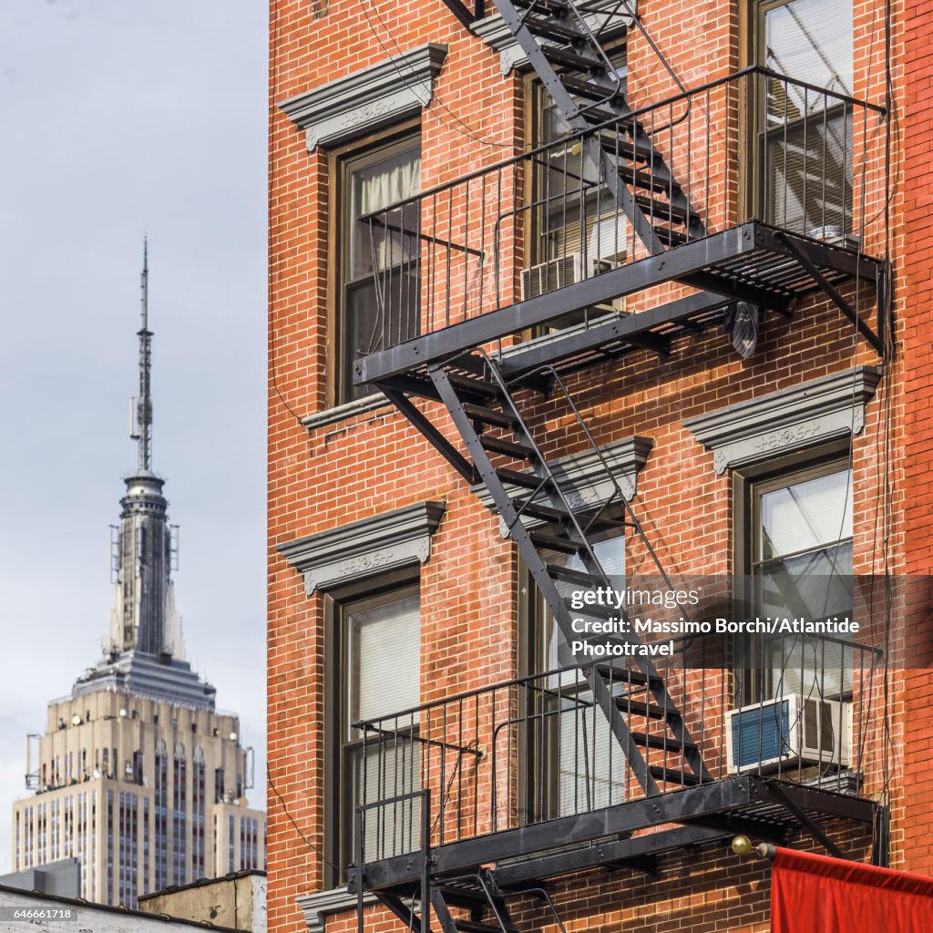 Manhattan, Chelsea, typical building and the Empire State Building on the background