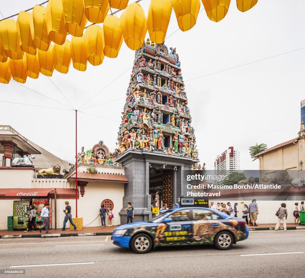 Chinatown, taxi near the entrance of Sri Mariamman Temple, in the upper part decorations for New Chinese Year