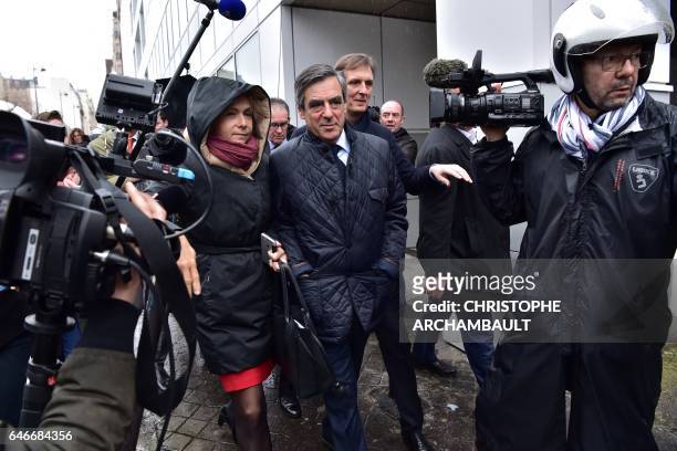 French presidential election candidate for the right-wing Les Republicains party Francois Fillon , flanked by Fillon's campaign spokesperson Jerome...
