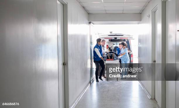 emergency at the hospital - medical transportation stock pictures, royalty-free photos & images
