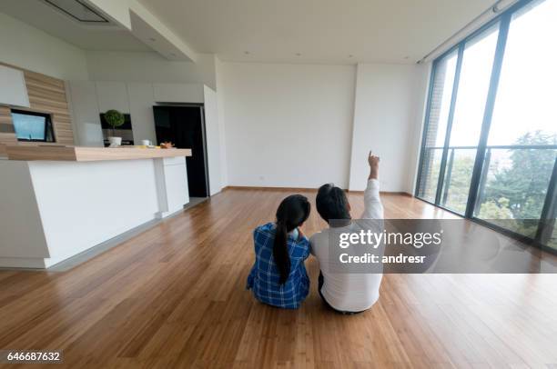 couple at their new home - unfurnished stock pictures, royalty-free photos & images