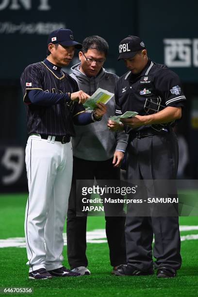 Manager Hiroki Kokubo of Japan calls changes before the bottom of the ninth inning during the SAMURAI JAPAN Send-off Friendly Match between CPBL...