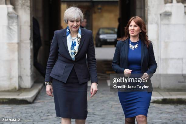 British Prime Minister Theresa May talks with newly elected Copeland MP Trudy Harrison outside the Houses of Parliament on March 1, 2017 in London,...