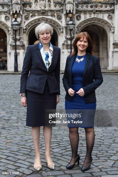 British Prime Minister Theresa May poses with newly elected Copeland MP Trudy Harrison outside the Houses of Parliament on March 1, 2017 in London,...