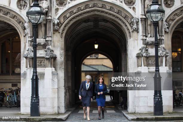 British Prime Minister Theresa May walks with newly elected Copeland MP Trudy Harrison outside the Houses of Parliament on March 1, 2017 in London,...