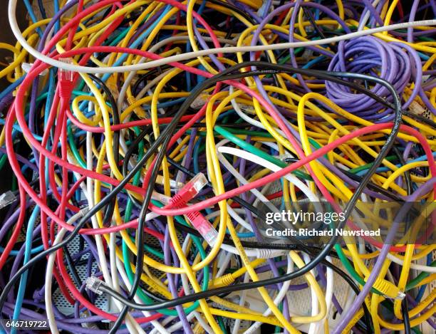 tangled cables - bandwidth management stock pictures, royalty-free photos & images