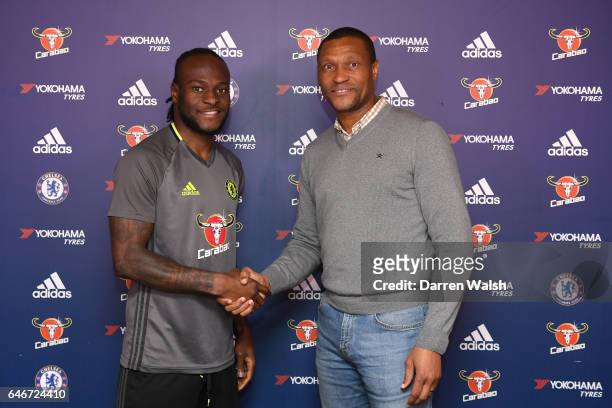 Victor Moses of Chelsea signs a new contract at Chelsea FC with Technical Director Michael Emenalo at Chelsea Training Ground on March 1, 2017 in...
