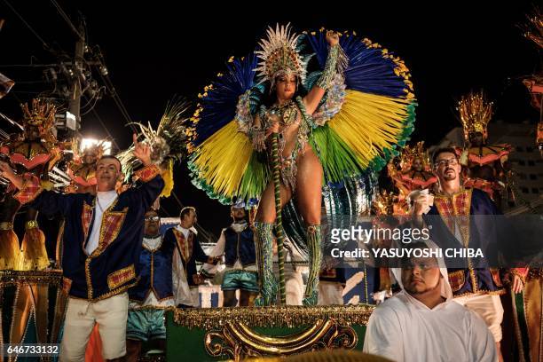 Revellers of Caprichosos de Pilares samba school perform during their parade on Intendente Magalhaes street in Rio de Janeiro, Brazil, on February...