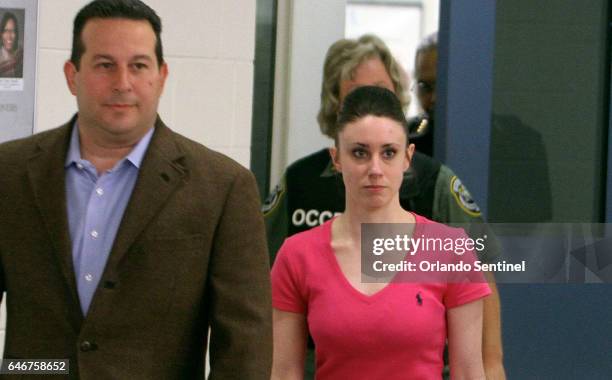 Attorney Jose Baez escorts Casey Anthony as she leaves the Orange County Corrections Facility on July 17 in Orlando, Fla.