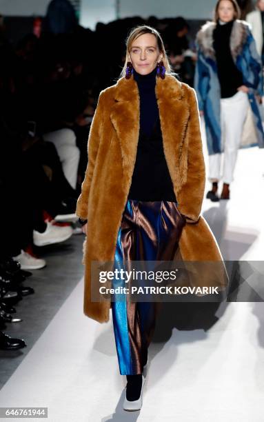 Belgian model Hannelore Knuts presents a creation by Dries Van Noten during the women's Fall-Winter 2017-2018 ready-to-wear collection fashion show...