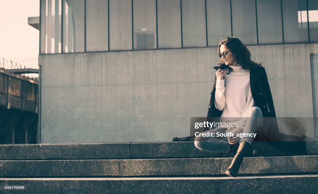 Girl sitting on steps