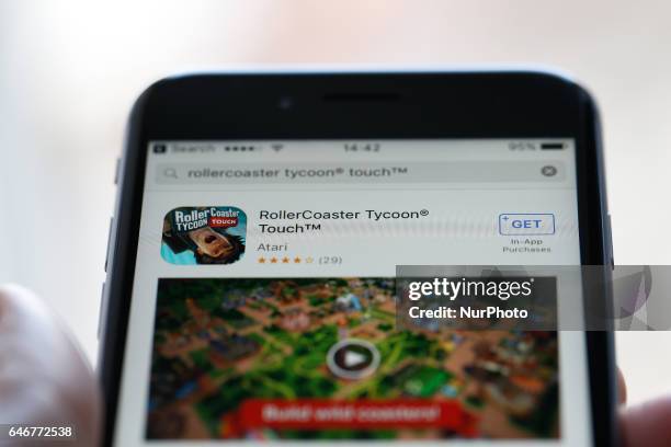 The popular RollerCoaster Tycoon game is seen in the iTunes App Store on 1 March, 2017 in Bydgoszcz, Poland. Recenlty the newer version, the Touch...