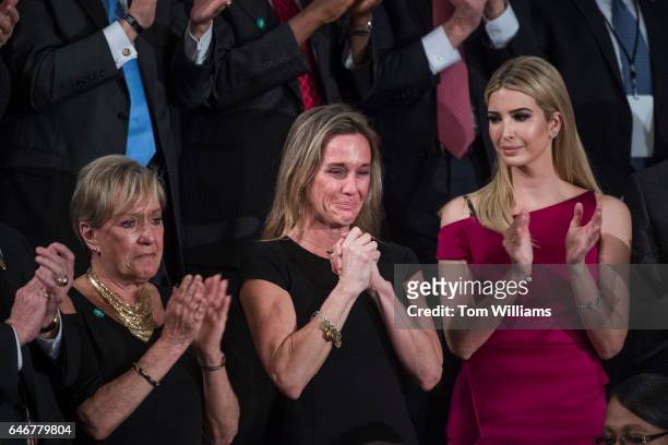 Carryn Owens, widow of Navy SEAL, William Ryan Owens, reacts after being recognized by President Donald Trump during his address to a joint session...