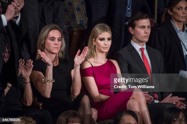 Ivanka Trump, center, her husband Jared Kushner, and Carryn Owens, widow of Navy SEAL, William Ryan Owens, listen to President Donald Trump address...