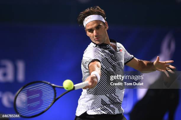 Roger Federer of Switzerland plays a forehand during his second round match against Evgeny Donskoy of Russia on day four of the ATP Dubai Duty Free...