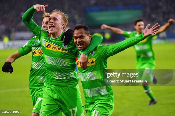 Raffael of Moenchengladbach celebrates his team's second goal with team mate Oscar Wendt during the DFB Cup quarter final between Hamburger SV and...