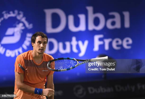 Evgeny Donskoy of Russia celebrates winning his second round match against Roger Federer of Switzerland on day four of the ATP Dubai Duty Free Tennis...
