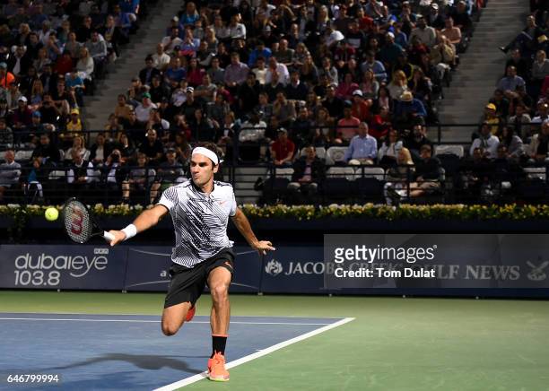 Roger Federer of Switzerland returns a shot during his second round match against Evgeny Donskoy of Russia on day four of the ATP Dubai Duty Free...