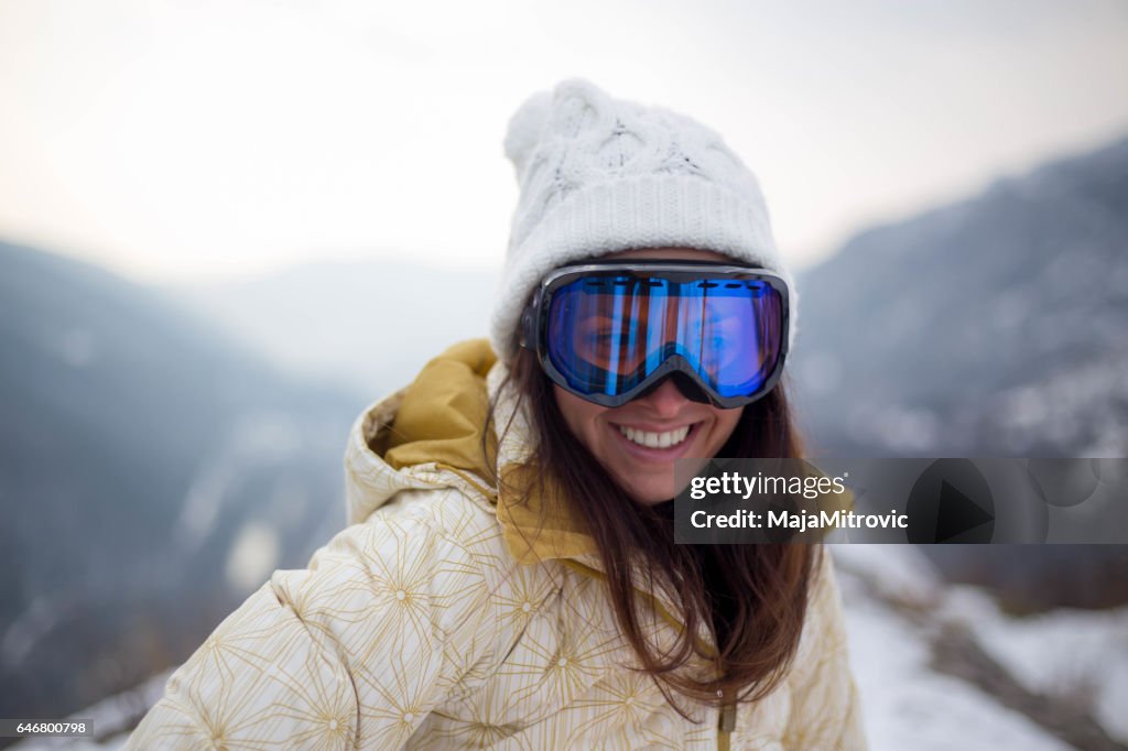 Girl in a mask for snowboarding