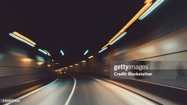 the tunnel in the city - car moving foto e immagini stock