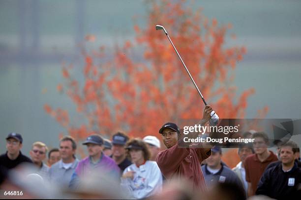 Tiger Woods follows his tee shot during The Tour Championship presented by Southern Company at the East Lake Golf Course in Atlanta,...