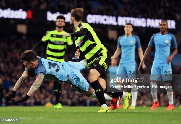 Manchester City's Nicolas Otamendi is brought down inside the area by Huddersfield Town's Jon Gorenc Stankovic, resulting in a penalty, during the...