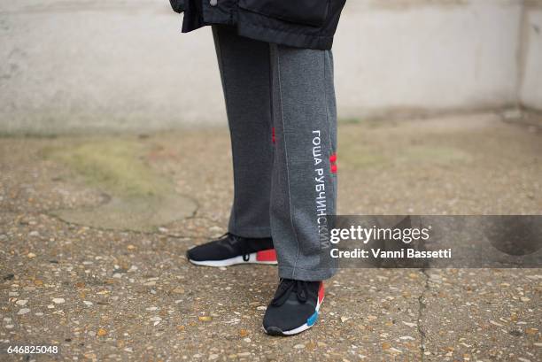 Leah Angeles poses wearing Gosha Rubchinskiy pants and Adidas shoes after the Maison Margiela show at the Grand Palais during Paris Fashion Week...