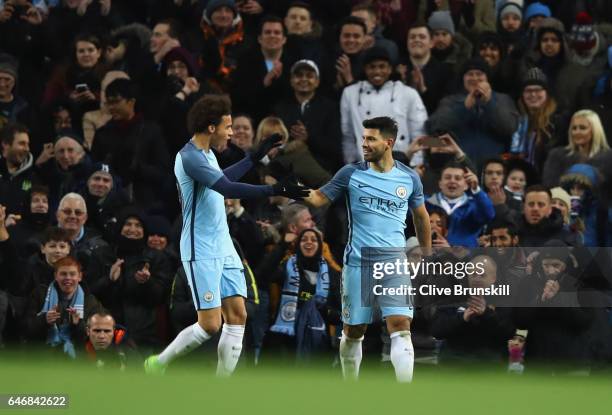 Sergio Aguero of Manchester City celebrates with Leroy Sane as he scores their fourth goal during The Emirates FA Cup Fifth Round Replay match...