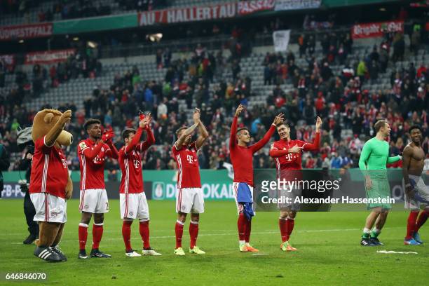 Players of Muenchen celebrate with the fans after the DFB Cup quarter final between Bayern Muenchen and FC Schalke 04 at Allianz Arena on March 1,...