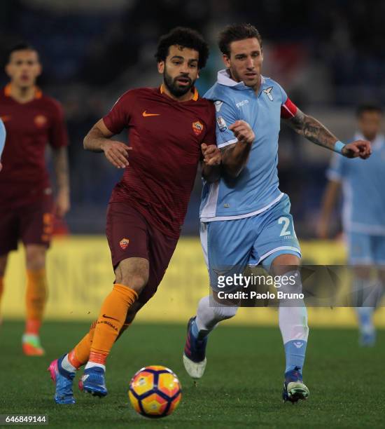 Lucas Biglia of SS Lazio competes for the ball with Mohamed Salah of AS Roma during the TIM Cup match between SS Lazio and AS Roma at Olimpico...