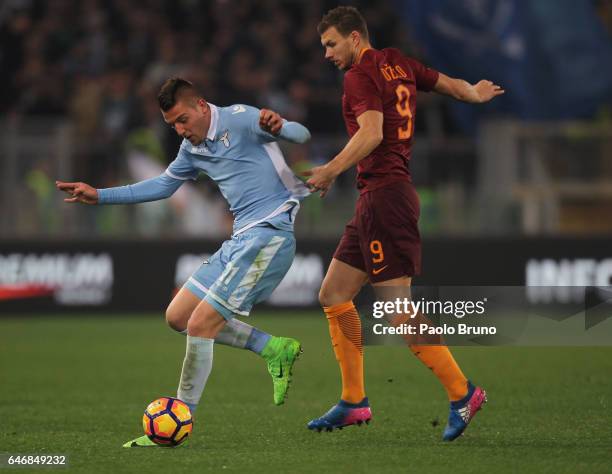 Sergej Milinkovic of SS Lazio competes for the ball with Edin Dzeko of AS Roma during the TIM Cup match between SS Lazio and AS Roma at Olimpico...