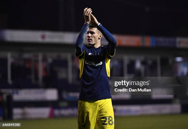 Marvin Johnson of Oxford United applauds the fans following his side's victory during the EFL Checkatrade Trophy Semi Final match between Luton Town...