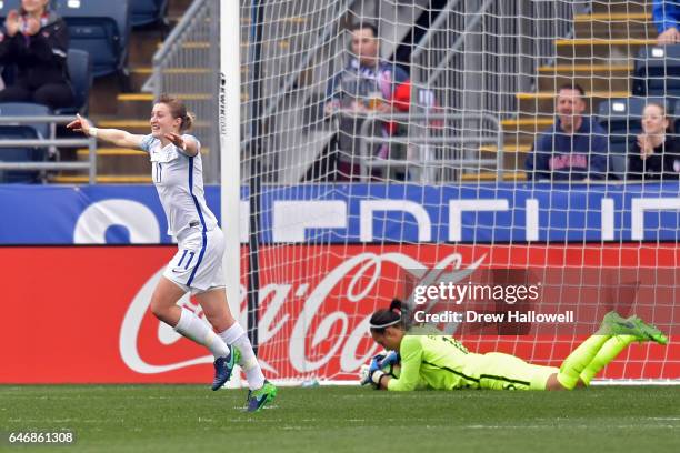 Ellen White of England celebrates a teammate's goal as she passes goalkeeper Sarah Bouhaddi of France during the SheBelieves Cup at Talen Energy...