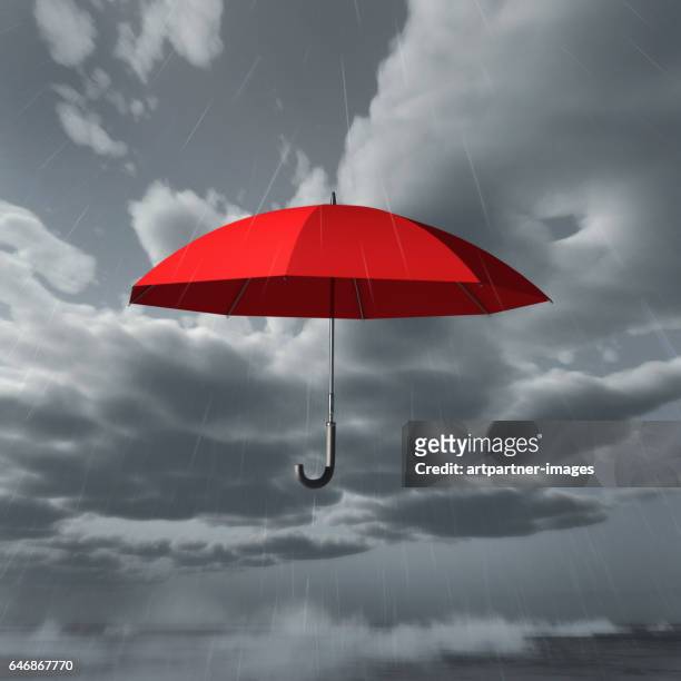 rain falls on red umbrella - heidelberg project stock pictures, royalty-free photos & images