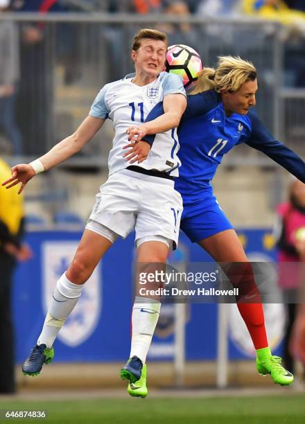 Ellen White of England and Claire Lavogez of France go up to head the ball during the SheBelieves Cup at Talen Energy Stadium on March 1, 2017 in...