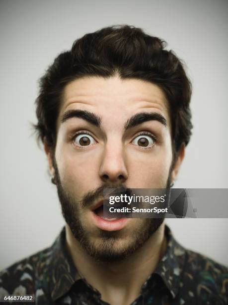 portrait of a real shocked man - annoyed face brunnette stock pictures, royalty-free photos & images