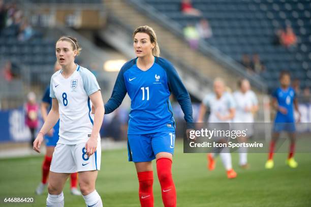 French Midfielder Claire Lavogez and English Midfielder Jade Moore wait for a free kick in the first half during the game between the England Women's...