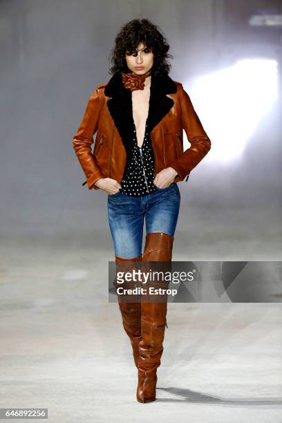 Model walks the runway during the Saint Laurent designed by Anthony Vaccarello show as part of the Paris Fashion Week Womenswear Fall/Winter...