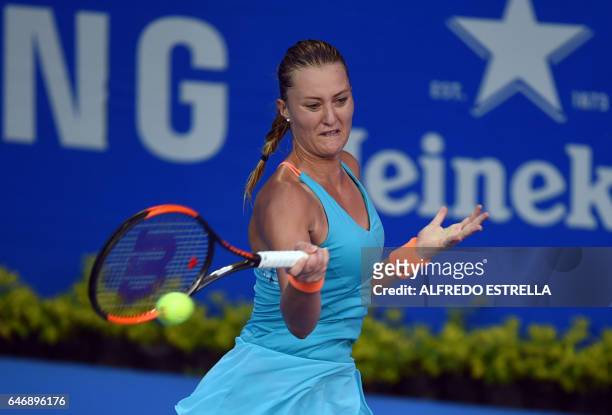 French tennis player Kristina Mladenovic returns the ball to UK tennis player Heather Watson during the third day of the Mexican Tennis Open, in...