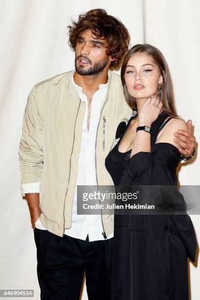 Marlon Teixeira and Marie Ange Casta attend the H&M Studio show as part of the Paris Fashion Week on March 1, 2017 in Paris, France.